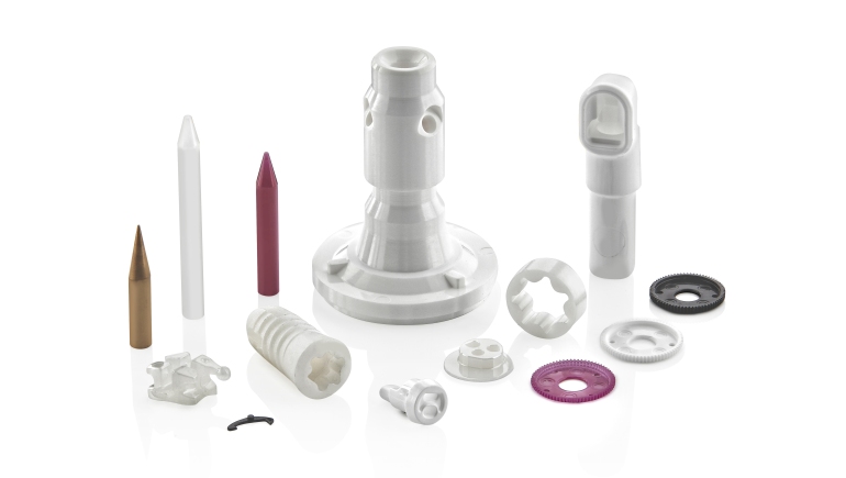 picture of various molded ceramic parts on white background